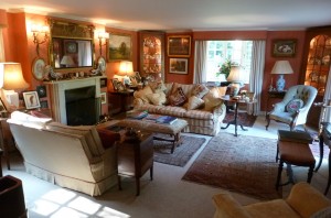 Our guests can relax in the sitting room with its log fire, fine antiques, big comfy sofas